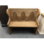 A reclaimed pine Gothic style bench