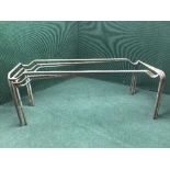 Three metal table legs or bases