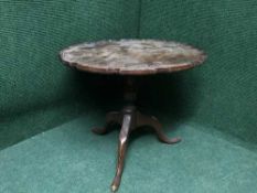 A mahogany pie crust edge occasional table