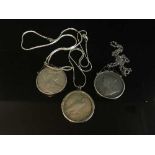 Three silver coin pendants to include a 1900 Crown,