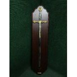 A large ornamental sword on wooden board - Excaliber