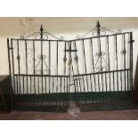 A pair of wrought iron garden gates