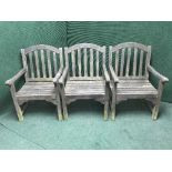 A two seater garden bench and three chairs