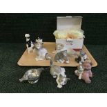 A collection of seven Nao and Lladro cats, one boxed,