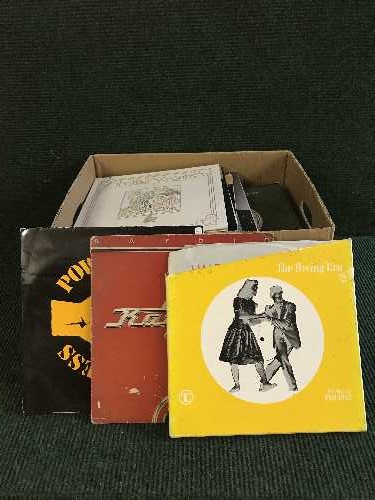 A box of records and box of cds and dvds