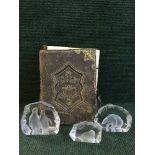 A Victorian leather bound family bible and three glass paperweights