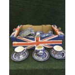 Two boxes of blue and white Willow pattern dinner ware,