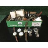 A box containing a large quantity of wrist watches (Q)