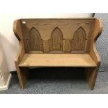 A reclaimed pine Gothic style bench