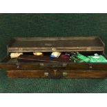 Two stained pine boxes containing gun cleaning equipment