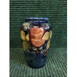 A blue glazed Moorcroft vase,