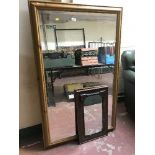 A pine framed mirror and a mahogany framed mirror