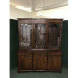 An inlaid mahogany triple door bookcase