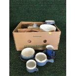 A box of Denby Colbalt blue dinner ware