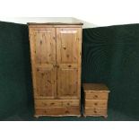 A pine double door wardrobe and a bedside chest