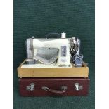 A Jones electric sewing machine and part cased picnic set