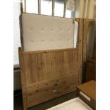 An Ikea 4'6 pine bed frame with mattress