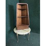 A set of mahogany corner shelves,