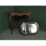 A shaped occasional table and an oak framed mirror