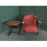 An early 20th century oak armchair and an occasional table