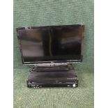 A Toshiba 26 inch LCD TV with remote and a Panasonic DVD/VCR recorder and remote