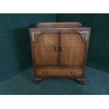 An oak linen cupboard fitted a drawer