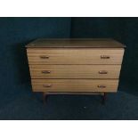 A mid 20th century teak three drawer chest