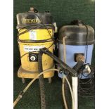 Two industrial vac cleaners