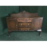 An oak sideboard on pad feet