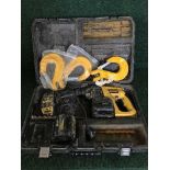 A cased Dewalt drill and a box of overalls,
