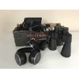 A box of assorted Philips and Sony headphones, pair of Clubman binoculars,