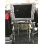 A Beko 21 inch lcd tv with lead and remote on three tier stand