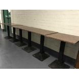 A set of six square marble topped metal based cafe tables