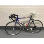 A Trek US Postal team colours road bike, OCLV carbon frame, blue, grey, white and red, medium frame,
