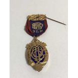 A 9ct gold and enamel medal, 'Presented to Bro George Harwood K.O.M.