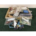 A box of assorted costume jewellery and mobile phone charms
