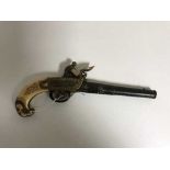 An ornate 19th century stle flintlock pistol