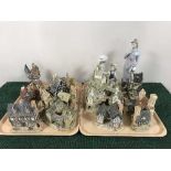 Two trays of two Lladro figures and nine David Winter cottages