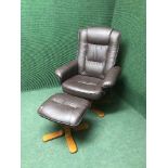 A brown leather swivel relaxer chair with stool