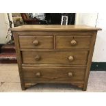An early twentieth century pine four drawer chest