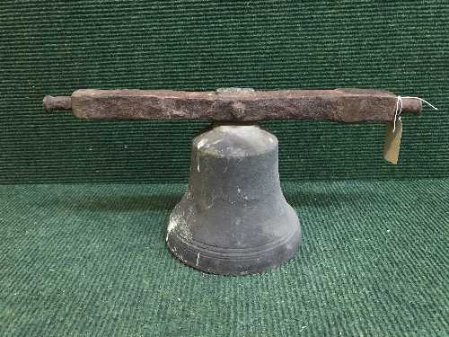 An antique bell on cast iron fixing arm