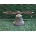 An antique bell on cast iron fixing arm