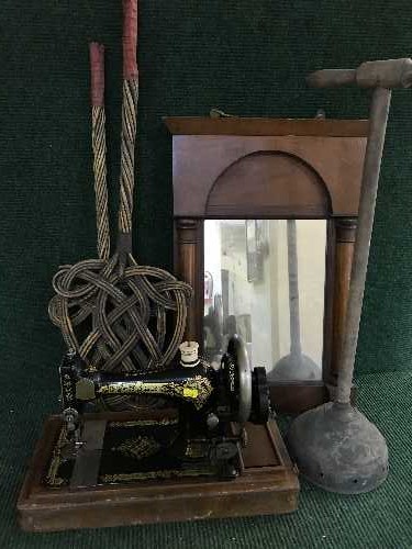 A mahogany cased hand singer sewing machine together with a Victorian mahogany mirror,