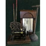 A mahogany cased hand singer sewing machine together with a Victorian mahogany mirror,