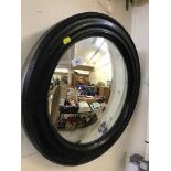 A circular convex porthole mirror