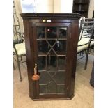 A Victorian mahogany hanging corner cabinet