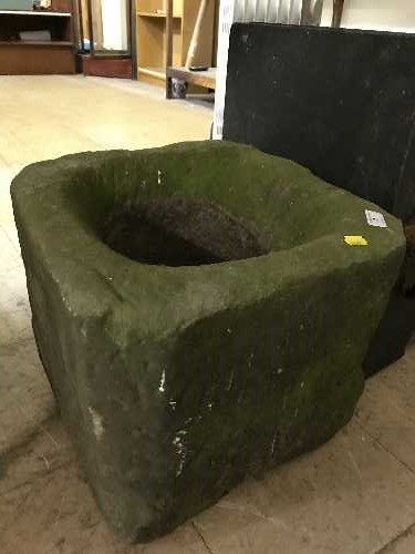 An antique stone garden planter