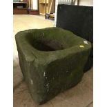 An antique stone garden planter