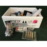 A box of fishing accessories including hooks, lures,