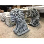 A pair of garden lion figures